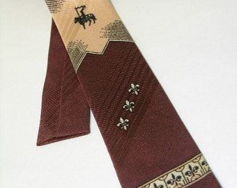 vintage 1950's Men's neck tie. Two-tone Brown & Peach. Fleur-de-lis and a Knight motifs.