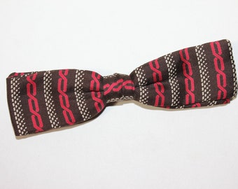 vintage 1950's -Ormond- 'clip-on' bow tie. Striking print on Brown rayon or silk. Very nice!