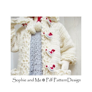 May include: A white crocheted cardigan with a hood and red and gray accents. The cardigan has a textured stitch and a pom-pom on the hood. "Sophie and Me &copy; Pdf Pattern Design" is written on the bottom of the image.