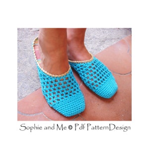May include: A pair of turquoise blue crocheted slippers with a tan crocheted trim. The slippers are open-toed and have a woven pattern.