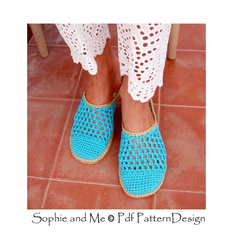May include: A pair of blue crocheted slippers with a tan sole. The slippers are open-toed and have a woven design.