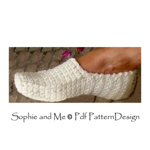 May include: White crocheted slipper with a simple design. The slipper is made with a soft yarn and has a comfortable fit.