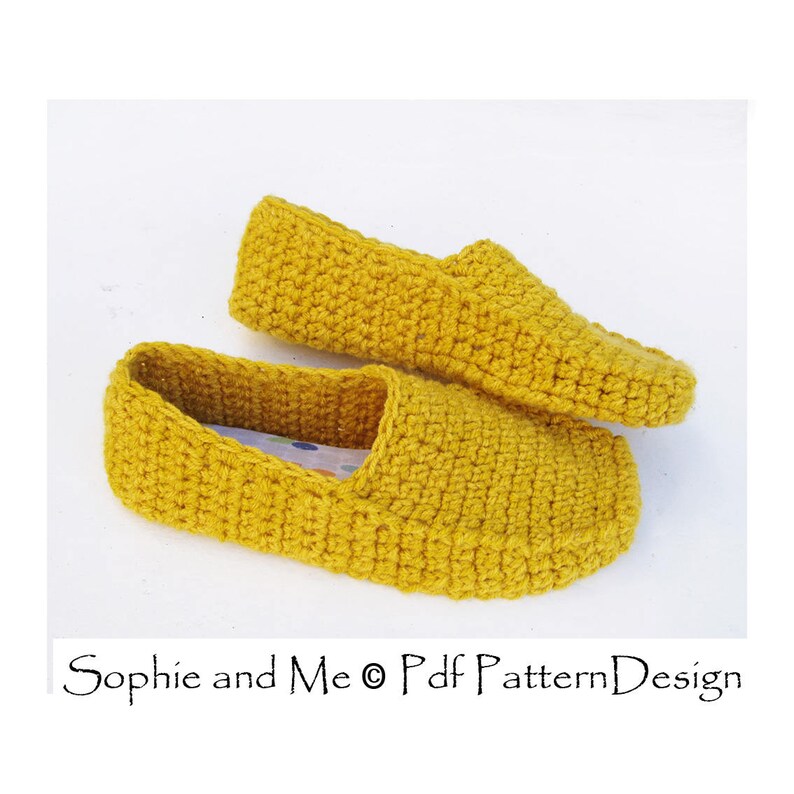 May include: A pair of yellow crocheted slippers. The slippers are made with a simple stitch and have a flat sole.