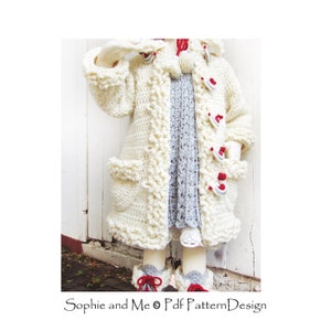 May include: A white crocheted coat with red and white buttons and a white pom-pom on the hood. The coat has a scalloped edge and pockets on the sides.  "Sophie and Me &copy; Pdf Pattern Design" is printed on the bottom of the image.