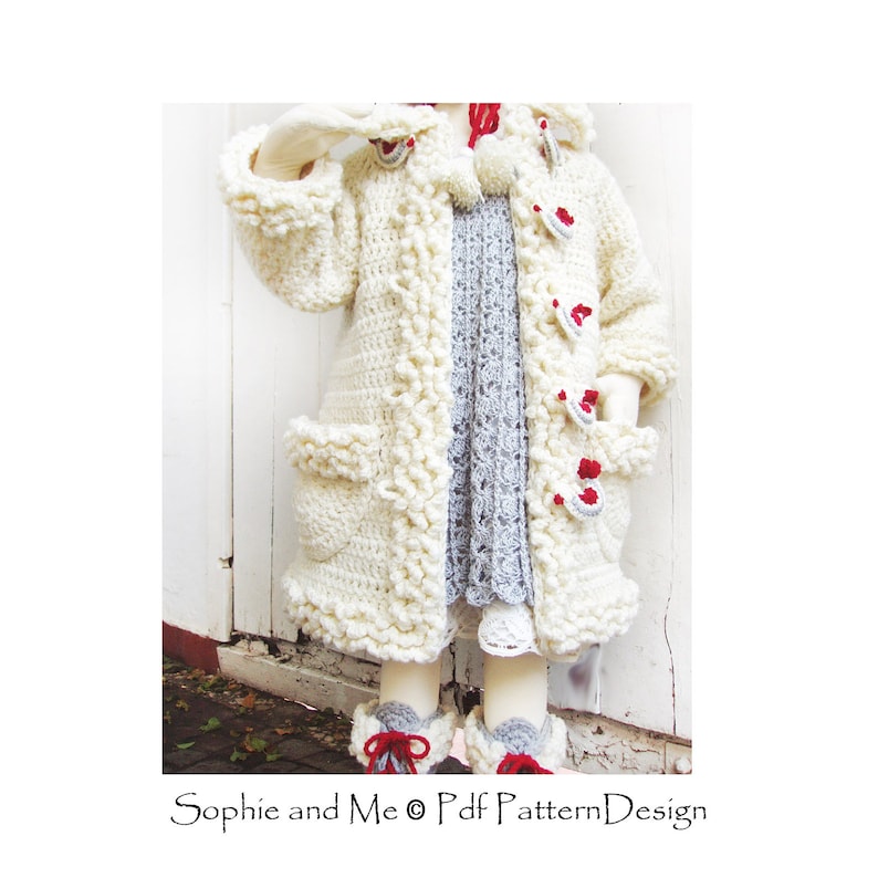 May include: A white crocheted coat with red and white buttons and a white pom-pom on the hood. The coat has a scalloped edge and pockets on the sides.  "Sophie and Me &copy; Pdf Pattern Design" is printed on the bottom of the image.