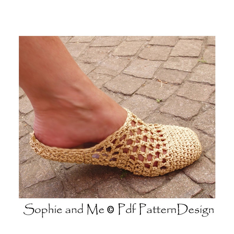 May include: A close-up of a crocheted beige slipper with a woven pattern. The slipper is on a stone surface.