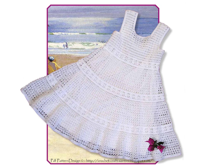 May include: White crochet dress with a sleeveless design and a tiered skirt. The dress is photographed against a beach scene.