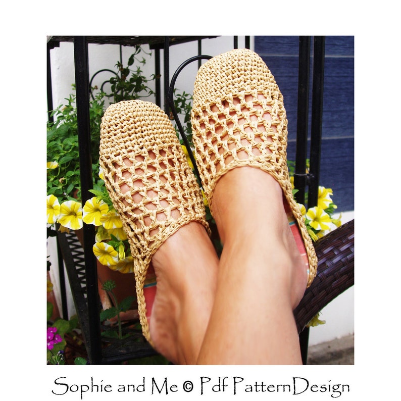 May include: A pair of crocheted beige sandals with a grid pattern. The sandals are worn by a person sitting on a wicker chair.