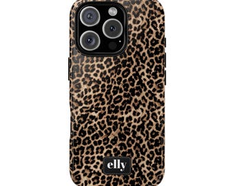 May include: A phone case with a leopard print design. The case is brown and black with a glossy finish. The case has a black camera module with three lenses and a flash. The brand name "elly" is printed in white on a black rectangle at the bottom.