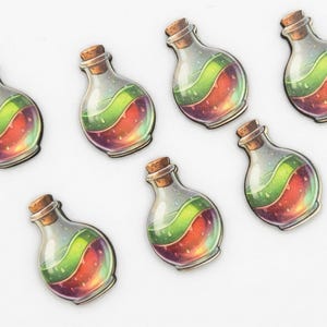 May include: Seven potion bottle stickers with cork stoppers. Each bottle contains a layered liquid with green and red hues. The bottles are clear with a slight iridescent sheen, and the overall design has a fantasy theme.