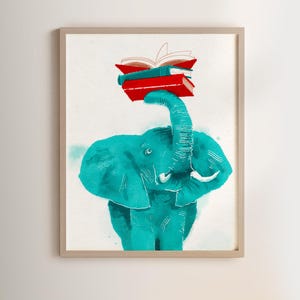 May include: A framed watercolour print featuring a teal elephant balancing a stack of books on its trunk. The books are red and green. The frame is light wood, and the background is white.