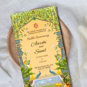 May include: An invitation card for a Haldi Ceremony, featuring a yellow background with ornate green and gold decorative elements. The card includes the names Aarohi and Sunil, the date May 20, 2026, and the time 11:00 AM. The card is placed on a wooden plate.