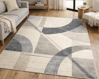 Alfombra geométrica abstracta moderna en tonos neutros beige y gris para sala de estar