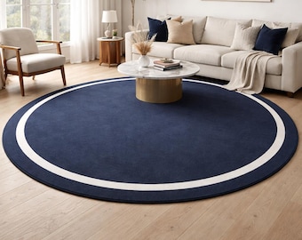Tappeto rotondo blu navy con bordo bianco, moderno e minimalista, per soggiorno di lusso