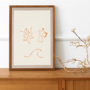 May include: Framed art print featuring minimalist line drawings of a bikini, a stovetop espresso maker, and a wave in orange on an off-white background. The artwork is displayed in a wooden frame, evoking a beach or vacation theme.