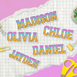 May include: Colorful name stickers with the names "Madison", "Olivia", "Jayden", "Daniel", and "Chloe". Each name is in a bold, outlined font with a waffle cone texture and pink and blue accents. The stickers are on a grid background.