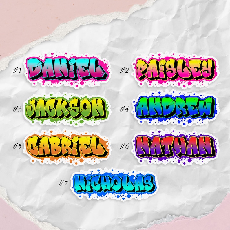 May include: A collection of seven name stickers in a graffiti style. Each sticker features a different name: Daniel, Paisley, Jackson, Andrew, Gabriel, Nathan, and Nicholas. The names are in bold, colorful lettering with a black outline.