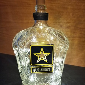 You pick between U.S. Army, Navy, Marines, air force lamp from recycled crown royal bottle and battery cork lights.
