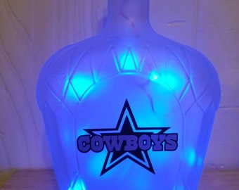 Homemade Dallas cowboys recycled crown royal bottle battery operated light.