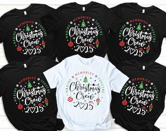 May include: Several black and white t-shirts with a Christmas-themed design. The shirts display the text "Christmas Crew 2025" in a circular layout, accompanied by a Christmas tree, baubles, and snowflakes. The words "Making Memories Together" encircle the central design.