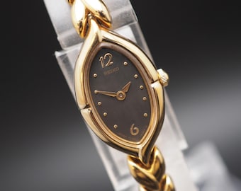 Vintage 1990 Seiko Dress Watch 1E20-6330 zwarte wijzerplaat 14 mm Qz damesarmband JAPAN