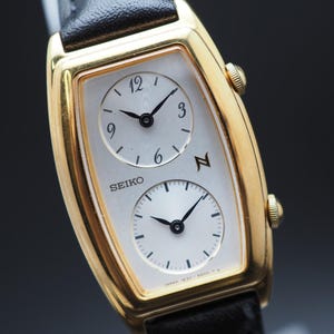 Amerikansk tullbetald vintage 1994 N MINT Seiko Noie 1E20-3A00 Dual Time Guld Qz Damklocka Japan