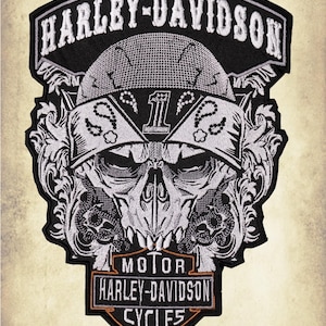 May include: Embroidered Harley-Davidson patch featuring a skull wearing a bandana with the number 1. The patch has the words "HARLEY-DAVIDSON" and "MOTOR HARLEY-DAVIDSON CYCLES" in white lettering on a black background.