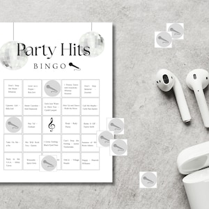 Party hits bingo printable game setup with headphones, fun music bingo cards for party, birthday or girls night activity