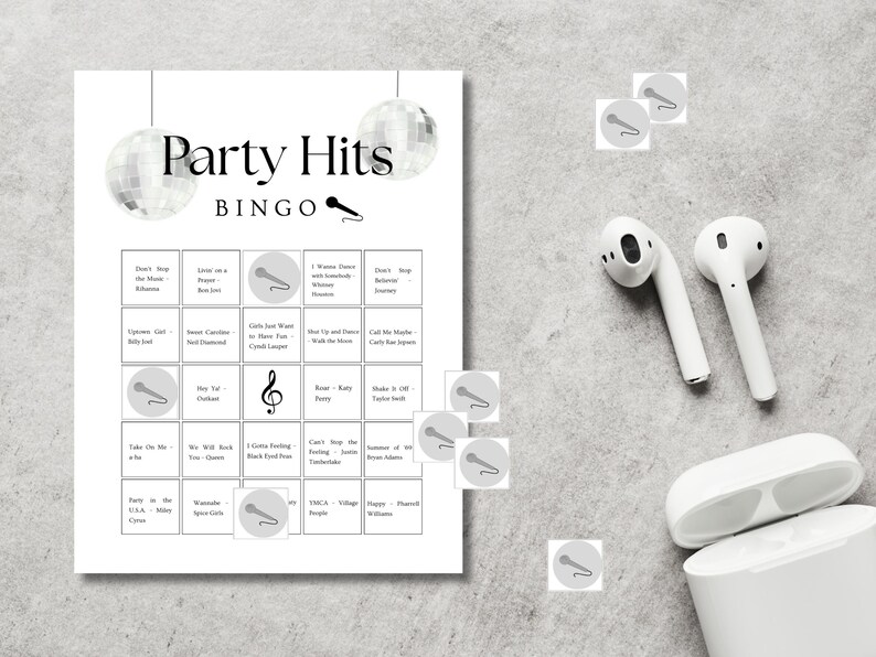 Party hits bingo printable game setup with headphones, fun music bingo cards for party, birthday or girls night activity