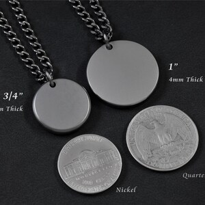 May include: Two silver round pendant necklaces with a chain. The smaller pendant is 3/4 inch in diameter and the larger pendant is 1 inch in diameter. Both pendants are 4mm thick. A US quarter and nickel are shown for size comparison.