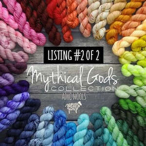 Peut inclure: Une collection d'écheveaux de fil colorés dans les tons de rose, rouge, orange, jaune, vert, bleu et violet. Le texte "LISTING #2 OF 2" et "Mythical Gods COLLECTION" est affiché sur un fond en bois.