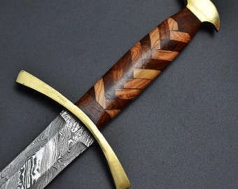 May include: A detailed image of a sword with a patterned wooden handle and a gold-colored crossguard and pommel. The blade has a distinctive, textured pattern. The handle is made of various shades of wood, arranged in a chevron pattern.