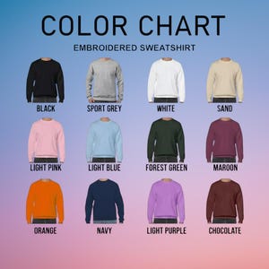 The image is a color chart for embroidered sweatshirts, displaying various colors such as black, grey, white, sand, light pink, light blue, forest green, maroon, orange, navy, light purple, and chocolate.