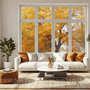 May include: A white sofa with orange and white throw pillows sits in a room with a large window showing autumn trees. A round coffee table, a brown ottoman, and two potted plants are present. The text VIRTUAL BACKGROUND THEDESIGNSS is visible.