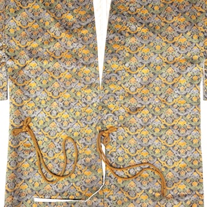 May include: A patterned kimono in shades of black, yellow, and green. The fabric features an intricate floral design. The kimono has long sleeves and a tie closure. The garment is open in the front, revealing a white lining.