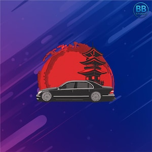 May include: Embroidered design featuring a black sedan in front of a red sun and a Japanese pagoda. The background has a gradient of blue and purple with white streaks. The BB Studio logo is in the upper right corner.