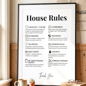 May include: A framed sign displaying "House Rules" in black, with various guidelines for guests. These include check-out times, cleanliness, and noise levels. The sign concludes with "Thank You" at the bottom.