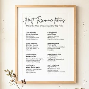May include: A framed print with the title "Host Recommendations" and a list of local attractions and dining options. The list is divided into categories like "Local Flavors" and "Kid-Approved Adventures."