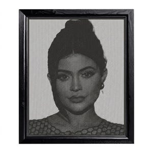 May include: A white ceramic mug with a black handle and the text "But First, Coffee" in a black, handwritten-style font. The mug is on a white surface.