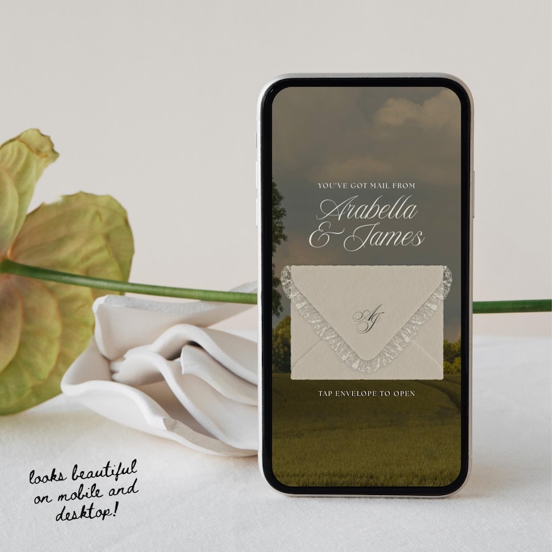May include: A smartphone displays a digital invitation with the text "YOU'VE GOT MAIL FROM Arabella & James." The invitation features a cream-colored envelope with lace trim and the text "TAP ENVELOPE TO OPEN." The image also includes the text "looks beautiful on mobile and desktop!"