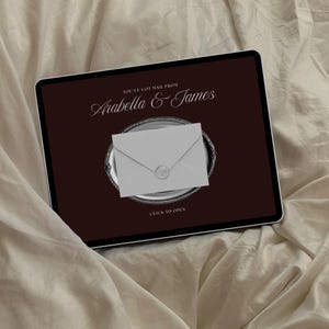 May include: A digital tablet displays a dark brown screen with the text "YOU'VE GOT MAIL FROM Arabella & James" in white script. A silver platter holds a gray envelope with a wax seal. The words "CLICK TO OPEN" are at the bottom.