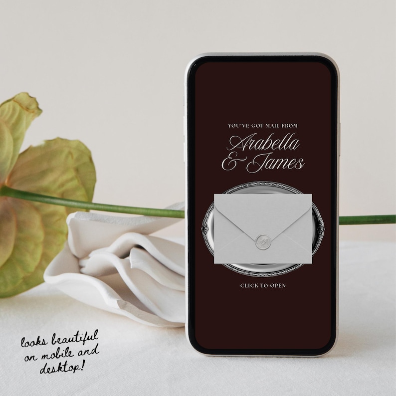 May include: A smartphone displays a digital invitation with the text "You've Got Mail From Arabella & James." The invitation features a white envelope on a silver platter, with the words "Click to Open" below. The text "looks beautiful on mobile and desktop!" is also visible.