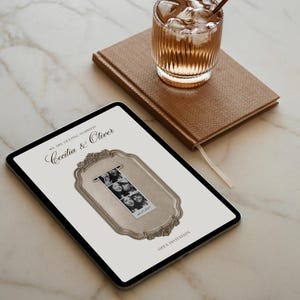 May include: A digital tablet displaying a wedding invitation with the text "WE ARE GETTING MARRIED! Cecilia & Oliver" and "OPEN INVITATION". The design features a central ornate gold frame graphic containing a black and white photo strip.