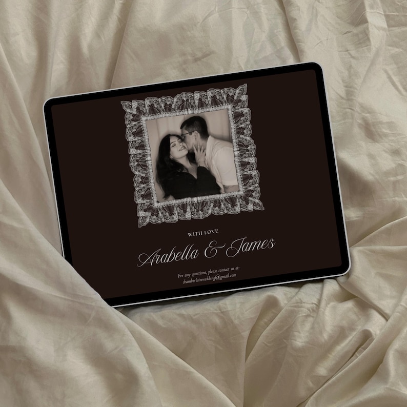 May include: A digital tablet displays a sepia-toned photograph of a couple kissing, framed by a white lace border. The background is a dark brown. The text "WITH LOVE" and the names "Arabella & James" are written in elegant script.