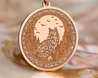 May include: Rose gold pendant necklace featuring a circular pendant with a detailed engraved design. The pendant depicts a fox sitting in front of a full moon, surrounded by trees and birds. The necklace is displayed on a pearlescent surface.