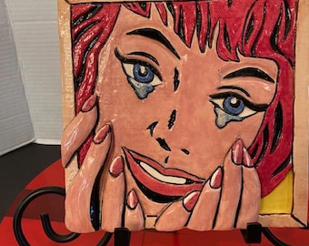 Azulejo de cerámica con diseño vintage de arte pop que representa "Lágrimas felices" de Roy Lichtenstein. Colorida, 19 x 19 cm.