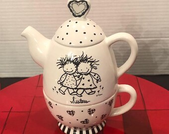 Juego de té para una persona y marco para fotos Enesco Marci Sisters (para fotos de 4 x 6 pulgadas)