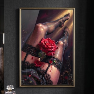 May include: A framed artwork featuring a sensual depiction of legs adorned with black lace garters and stockings. A large, vibrant red rose is placed between the legs. The artwork has a dark, moody aesthetic with a golden frame.