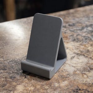 Minimalist Phone Stand Smartphone Holder Triangular Design Modern Aesthetic Desk Accessory Office Organization Workspace Addition Stylish