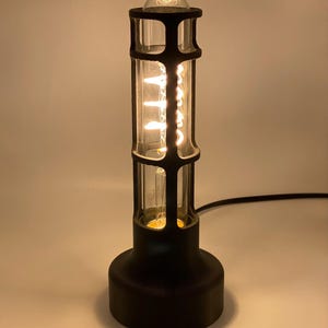 Retro Style Lamp Edison Bulb Feature Vintage Industrial Design Table Lamp Elegance Minimal Aesthetic Appeal Warm Glow Lighting Ambient Atmosphere Creator Bedside Table Accessory Reading Light Perfect Desk Companion Cylindrical Shape
